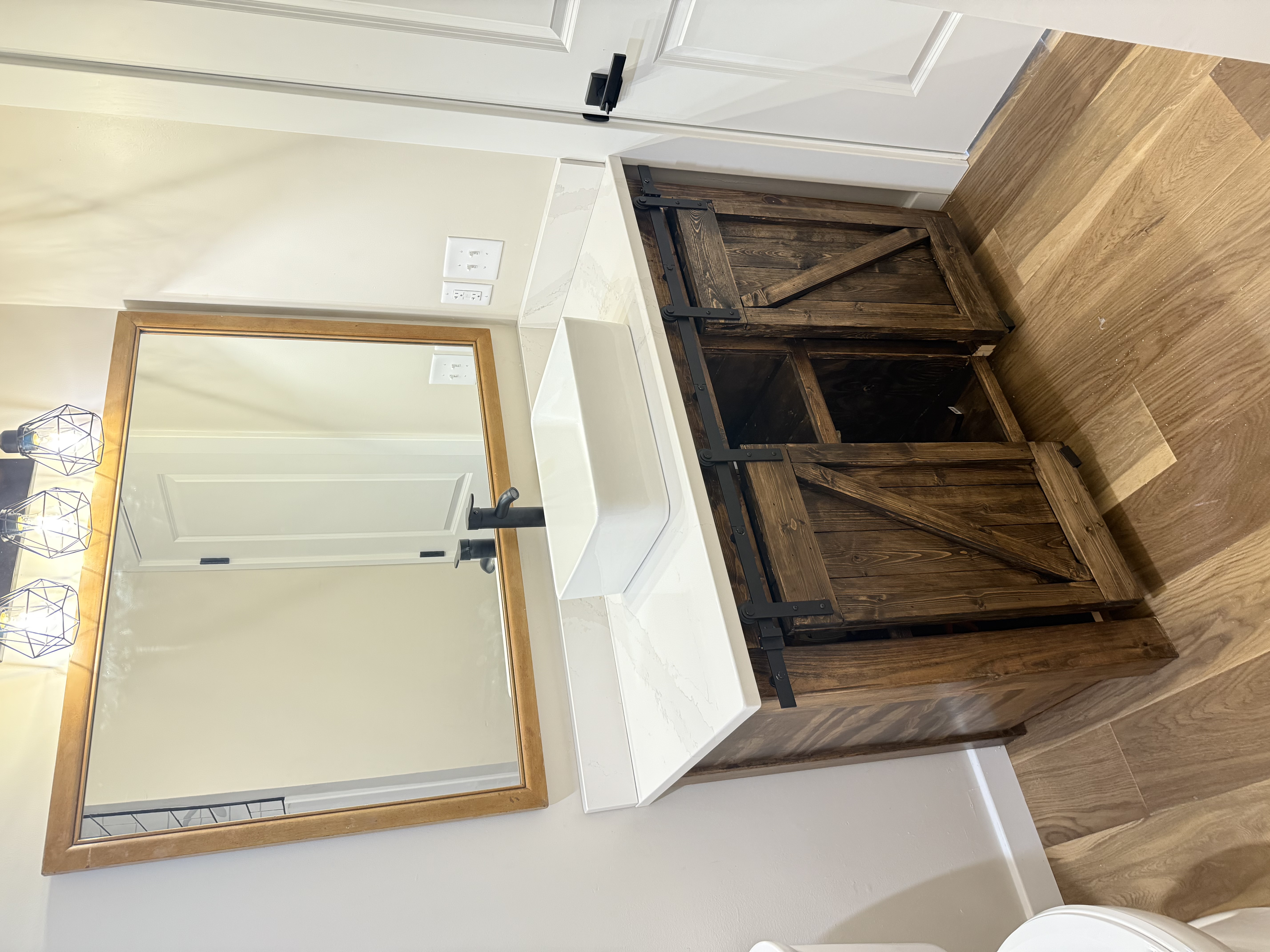 Barn door vanity with vessel sink and quartz countertop