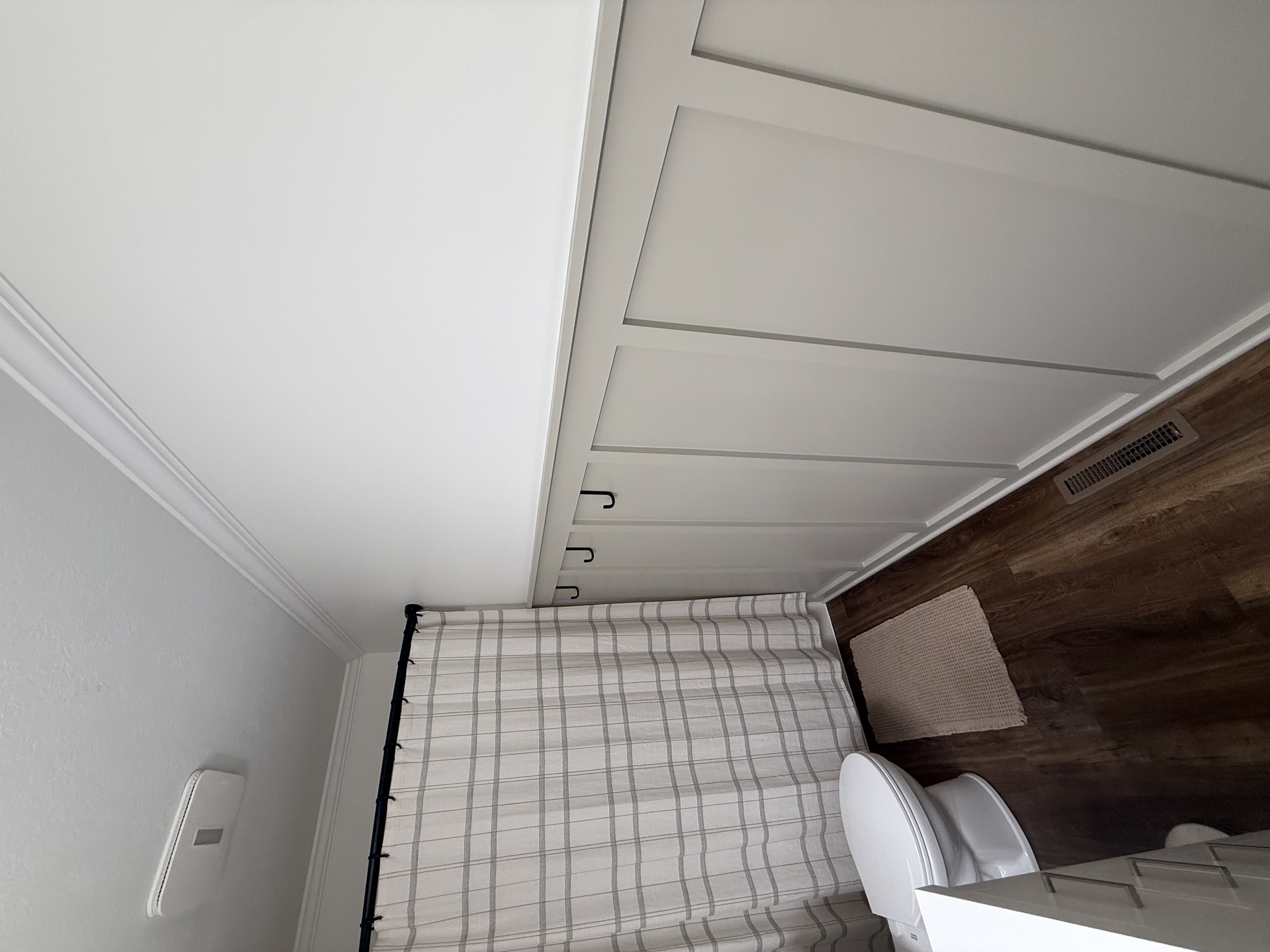 Board and batten wall treatment with crown molding detail