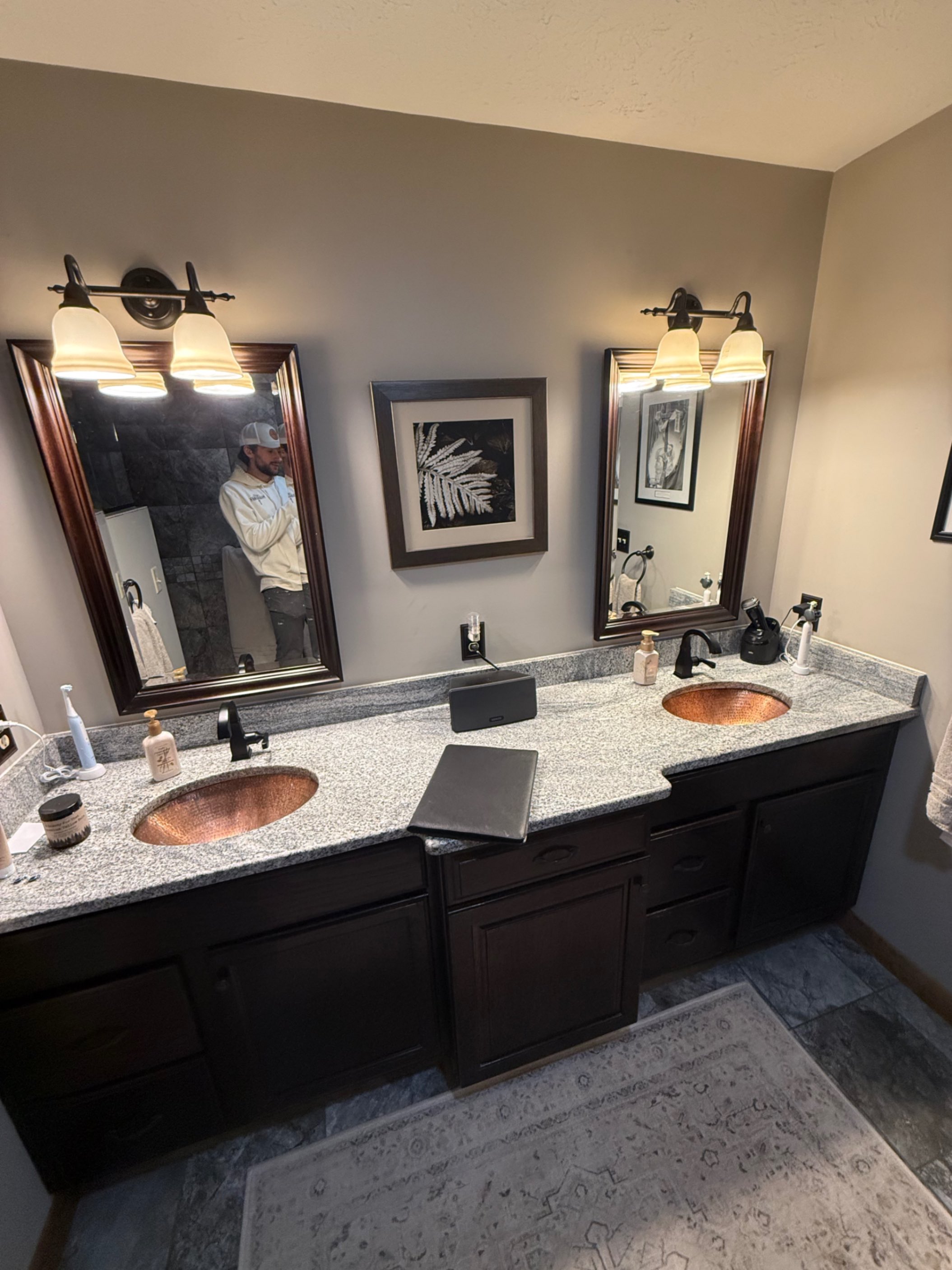 Bathroom before remodel — double vanity with copper sinks