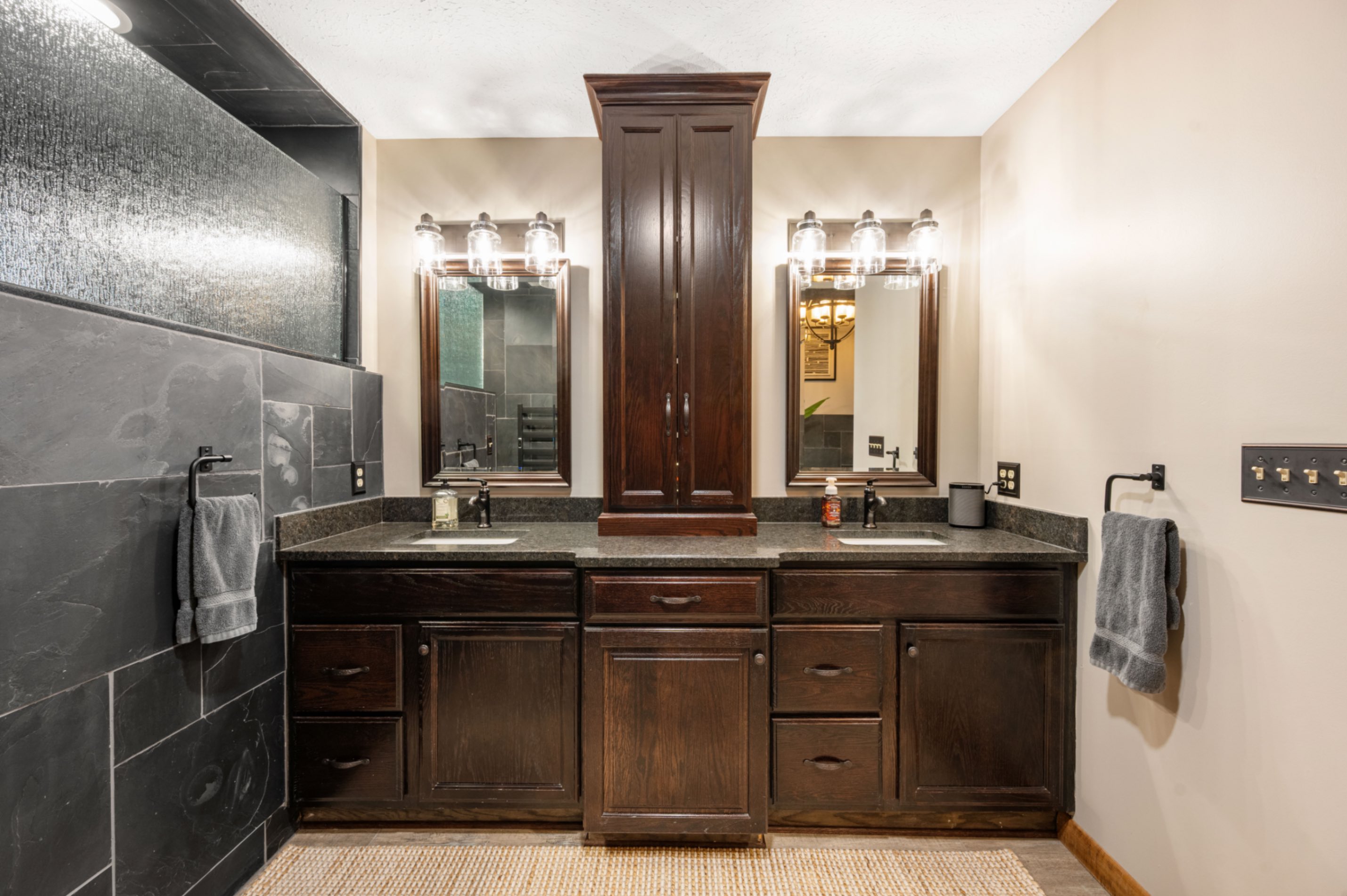 Finished double vanity with granite countertops and new light fixtures